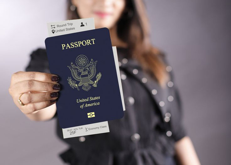 a woman hold a passport Bring your passport to the clubs